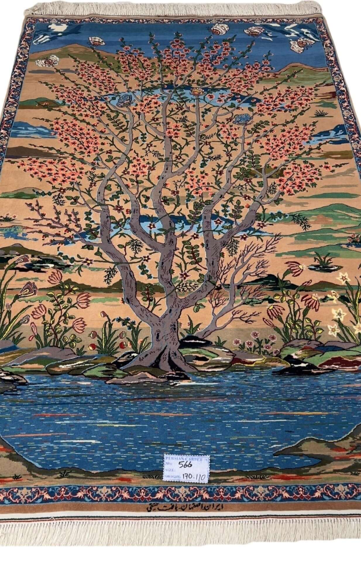 "Hand-knotted Persian rug by Master Haghighie featuring a serene tree and riverside motif."